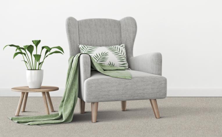 grey chair on grey carpet with wood side table and Lime Cream decor