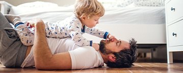 Kid on Floor with Father