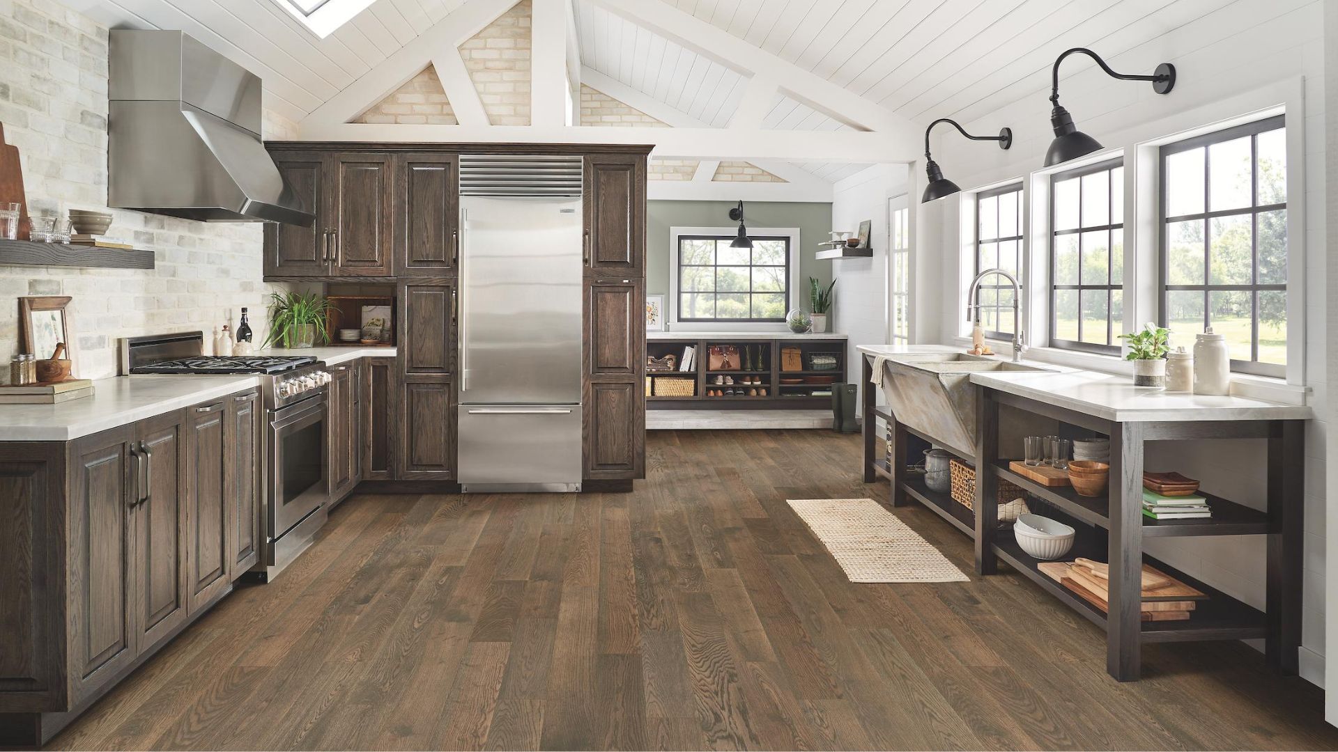 example of a professional hardwood flooring installation in a rustic and bright kitchen